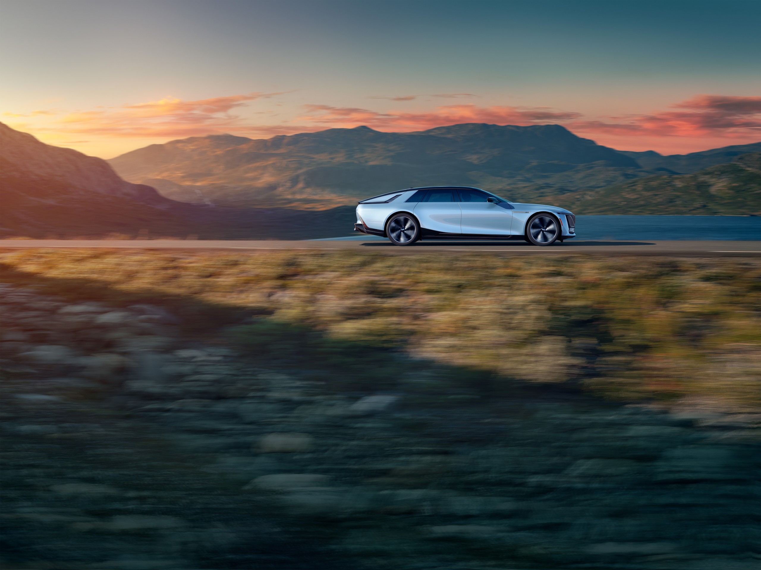 Белый Cadillac CELESTIQ в движении на горной дороге